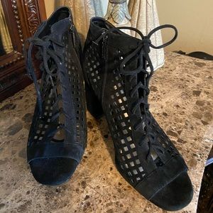 Caged black suede heels by Giani Bini